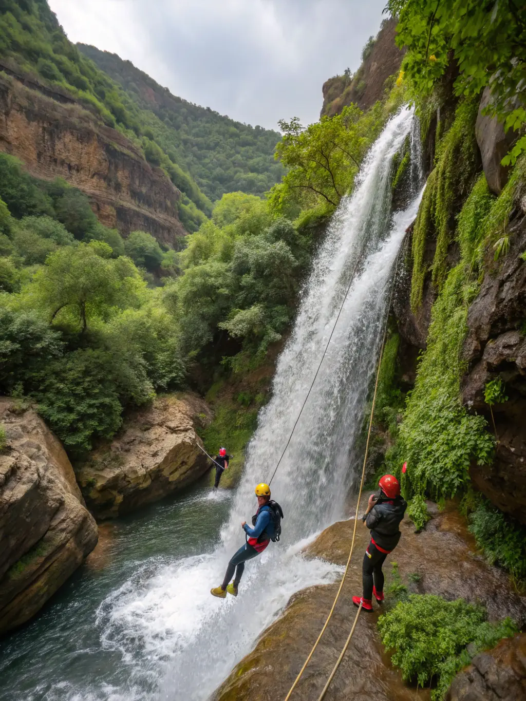 A dynamic image of people canyoning, rappelling down a waterfall, showcasing the adventurous nature of canyoning with L.V.M.H.D.